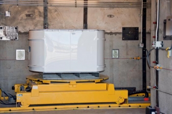 A standard waste box enters the HE-RTR at Los Alamos National Laboratory. The facility x-rays waste drums that contain high-density items such as motors and pumps and larger containers known as standard waste boxes. A standard waste box enters the HE-RTR at Los Alamos National Laboratory. The facility x-rays waste drums that contain high-density items such as motors and pumps and larger containers known as standard waste boxes.