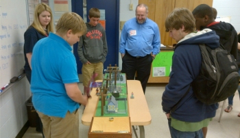 Southeastern employee, Dale Jett, uses a power system mockup to explain how power is distributed to homes. Southeastern employee, Dale Jett, uses a power system mockup to explain how power is distributed to homes.