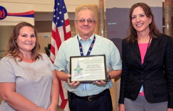 DOE Carlsbad Field Office (CBFO) Deputy Manager Ed Ziemianski presents the Green Zia Program Silver Level Leader award from the New Mexico Environment Department. Ziemianski is shown with Lynn Johnson (left), of Washington TRU Solutions LLC, the Waste Isolation Pilot Plant (WIPP) management and operating contractor, Regulatory Compliance, and CBFO Environmental Protection Specialist Susan McCauslin, program lead for the WIPP team. DOE Carlsbad Field Office (CBFO) Deputy Manager Ed Ziemianski presents the Green Zia Program Silver Level Leader award from the New Mexico Environment Department. Ziemianski is shown with Lynn Johnson (left), of Washington TRU Solutions LLC, the Waste Isolation Pilot Plant (WIPP) management and operating contractor, Regulatory Compliance, and CBFO Environmental Protection Specialist Susan McCauslin, program lead for the WIPP team.