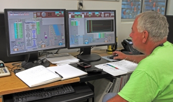 Nuclear Chemical Operator Mike Fish monitors operations of a pump-and-treat system at the Hanford site. Nuclear Chemical Operator Mike Fish monitors operations of a pump-and-treat system at the Hanford site.