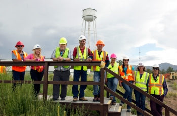 EMâs federal team for the demolition project, from left, Fire Coordinator Allan Trujillo, DOE Intern Kathy Walker, DOE Contracting Officer Ken Snyder, DOE EM Headquarters/Deactivation & Decommissioning Lead Dinesh Gupta, DOE Federal Project Director Arturo Duran, DOE Facility Operations Representative Darlene Rodriguez, DOE Deputy Federal Project Director Ramoncita Massey, DOE Safety and Health Lead Cindy Casalina, and DOE Readiness Lead John Fredlund. EMâs federal team for the demolition project, from left, Fire Coordinator Allan Trujillo, DOE Intern Kathy Walker, DOE Contracting Officer Ken Snyder, DOE EM Headquarters/Deactivation & Decommissioning Lead Dinesh Gupta, DOE Federal Project Director Arturo Duran, DOE Facility Operations Representative Darlene Rodriguez, DOE Deputy Federal Project Director Ramoncita Massey, DOE Safety and Health Lead Cindy Casalina, and DOE Readiness Lead John Fredlund.