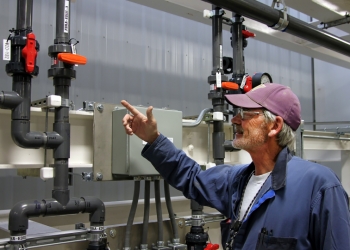 Soil and Groundwater Remediation Project Pipefitter John Reynolds explains some of the modifications he helped make at the 200 West Pump and Treat System that increased its water treatment capability. Soil and Groundwater Remediation Project Pipefitter John Reynolds explains some of the modifications he helped make at the 200 West Pump and Treat System that increased its water treatment capability.
