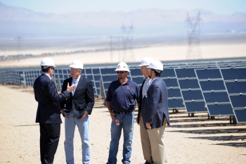 Secretary of the Interior Ken Salazar speaks with First Solar and Enbridge leadership at the Enbridge Silver State North solar project in Nevada. | Photo courtesy of Interior Department, credit Tami A. Heilemann. Secretary of the Interior Ken Salazar speaks with First Solar and Enbridge leadership at the Enbridge Silver State North solar project in Nevada. | Photo courtesy of Interior Department, credit Tami A. Heilemann.