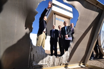 Secretary of Energy Steven Chu looks at half-inch thick sheet of aluminum that was melted in 23 seconds by 105 heliostats at the National Solar Thermal Test Facility at Sandia Labs in Albuquerque, NM. | Photo courtesy of Sandia National Laboratory Secretary of Energy Steven Chu looks at half-inch thick sheet of aluminum that was melted in 23 seconds by 105 heliostats at the National Solar Thermal Test Facility at Sandia Labs in Albuquerque, NM. | Photo courtesy of Sandia National Laboratory