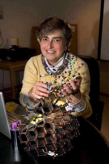 Vivian Stojanoff, a scientist at the U.S. Department of Energyâs Brookhaven National Laboratory, holding a protein crystal model. Stojanoff uses x-rays at the National Synchrotron Light Source to study how atoms are arranged in protein crystals, because the arrangement affects how proteins function. Vivian Stojanoff, a scientist at the U.S. Department of Energyâs Brookhaven National Laboratory, holding a protein crystal model. Stojanoff uses x-rays at the National Synchrotron Light Source to study how atoms are arranged in protein crystals, because the arrangement affects how proteins function.