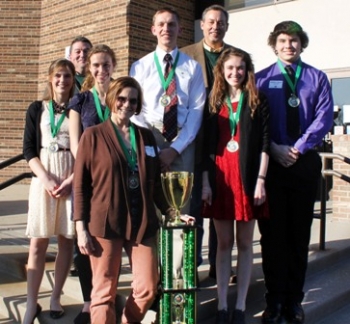 Zane Trace High School claimed the trophy and an all-expense paid trip to the National Science Bowl in Washington, D.C. Team members standing behind coach Nancy Robertson are, from left, Emily Joosse, Jessica Proehl, Tyler Moore, Kasandra Dalton, and Beau Bilek. The team is pictured with Greg Simonton (back left), South Central Ohio Regional Coordinator for EM, and Joel Bradburne (back right), Portsmouth Site Lead for EM. Zane Trace High School claimed the trophy and an all-expense paid trip to the National Science Bowl in Washington, D.C. Team members standing behind coach Nancy Robertson are, from left, Emily Joosse, Jessica Proehl, Tyler Moore, Kasandra Dalton, and Beau Bilek. The team is pictured with Greg Simonton (back left), South Central Ohio Regional Coordinator for EM, and Joel Bradburne (back right), Portsmouth Site Lead for EM.