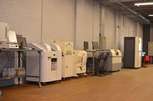 A view of additive manufacturing machines at the NAMII facility in Youngstown, Ohio. Photo credit: National Additive Manufacturing Institute. A view of additive manufacturing machines at the NAMII facility in Youngstown, Ohio. Photo credit: National Additive Manufacturing Institute.