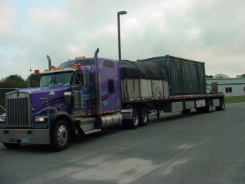 A truck carries a waste shipment from Brookhaven National Laboratory in New York. EM completed legacy cleanup activities at the site last year. A truck carries a waste shipment from Brookhaven National Laboratory in New York. EM completed legacy cleanup activities at the site last year.