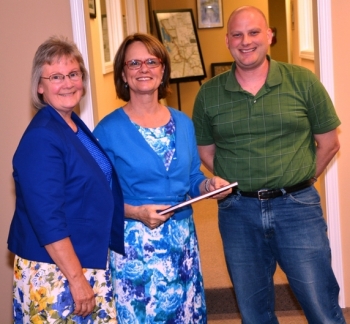 Judy Clayton, project leader and a member of the Paducah Citizen's Advisory Board (CAB), along with the CAB Vice Chair Ben Peterson, present a copy of the book to Cate Alexander (center), Designated Federal Officer of the EM Site-Specific Advisory Board. Judy Clayton, project leader and a member of the Paducah Citizen's Advisory Board (CAB), along with the CAB Vice Chair Ben Peterson, present a copy of the book to Cate Alexander (center), Designated Federal Officer of the EM Site-Specific Advisory Board.