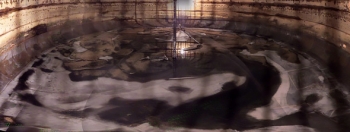 A composite image of dozens of individual-frame photos taken inside Tank C-110 provides a rare panoramic view of its interior. Portions of the tank floor and the Foldtrack waste-retrieval system are clearly visible. A composite image of dozens of individual-frame photos taken inside Tank C-110 provides a rare panoramic view of its interior. Portions of the tank floor and the Foldtrack waste-retrieval system are clearly visible.