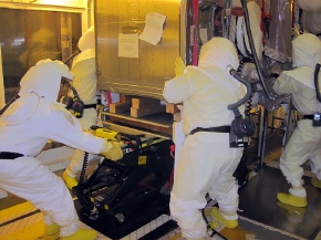 Workers separate a glove box for removal from Hanfordâs Plutonium Finishing Plant. Workers separate a glove box for removal from Hanfordâs Plutonium Finishing Plant.