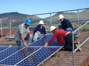 Participants in the Energy Department's Train-the-Trainers program in the Rocky Mountain region take part in a roof-mount solar panel install lab exercise at Solar Energy International's PV Lab Yard in Paonia, CO, in the summer of 2010. | Photo courtesy of Solar Energy International Participants in the Energy Department's Train-the-Trainers program in the Rocky Mountain region take part in a roof-mount solar panel install lab exercise at Solar Energy International's PV Lab Yard in Paonia, CO, in the summer of 2010. | Photo courtesy of Solar Energy International