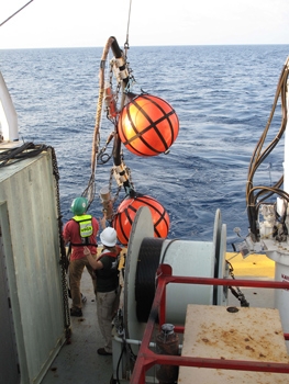 USGS technicians Eric Moore and Jenny White deploy instruments at the start of a seismic survey to explore gas hydrates in the deepwater Gulf of Mexico from April to May 2013 | Photo courtesy of USGS USGS technicians Eric Moore and Jenny White deploy instruments at the start of a seismic survey to explore gas hydrates in the deepwater Gulf of Mexico from April to May 2013 | Photo courtesy of USGS