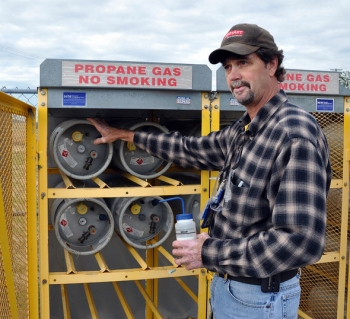Mike Tidwell performs a leak check and inspection on propane tanks Mike Tidwell performs a leak check and inspection on propane tanks