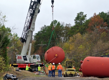 Workers recently removed five large mercury-contaminated tanks from Y-12. Workers recently removed five large mercury-contaminated tanks from Y-12.