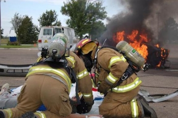 In a mock scenario, firefighters work with an accident victim during a Transportation Emergency Preparedness Program full field exercise In a mock scenario, firefighters work with an accident victim during a Transportation Emergency Preparedness Program full field exercise