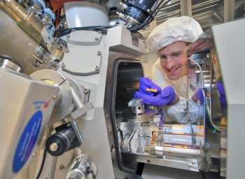 Kim Kisslinger, a researcher at Brookhaven Lab's Center for Functional Nanomaterials seen here with a focused-ion beam instrument, reduced the indium gallium nitride (InGaN) samples to a thickness of just 20 nanometers to prepare them for electron microscopy. | Photo courtesy of Brookhaven National Laboratory. Kim Kisslinger, a researcher at Brookhaven Lab's Center for Functional Nanomaterials seen here with a focused-ion beam instrument, reduced the indium gallium nitride (InGaN) samples to a thickness of just 20 nanometers to prepare them for electron microscopy. | Photo courtesy of Brookhaven National Laboratory.