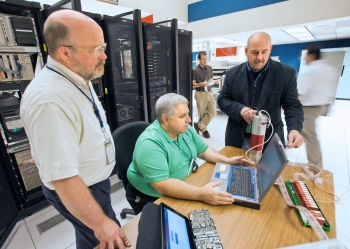 Charles Gentile (center) and other members of the MINDS team, including Ken Silber (right) and Bill Davis (left) work on new techniques to identify radionuclides. | Photo by Elle Starkman/Princeton Plasma Physics Laboratory Office of Communications Charles Gentile (center) and other members of the MINDS team, including Ken Silber (right) and Bill Davis (left) work on new techniques to identify radionuclides. | Photo by Elle Starkman/Princeton Plasma Physics Laboratory Office of Communications