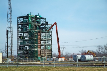 A high-reach shear removes debris from the tallest structure of the C-340 complex at Paducah. Watch a video of this work here. The 120-foot-high Metals Plant was the tallest building at the Paducah site and encompassed about 1.5 million cubic feet, the volume of a football field roughly three stories tall. Demolition debris filled 28 rail cars and was shipped offsite for disposal. A high-reach shear removes debris from the tallest structure of the C-340 complex at Paducah. Watch a video of this work here. The 120-foot-high Metals Plant was the tallest building at the Paducah site and encompassed about 1.5 million cubic feet, the volume of a football field roughly three stories tall. Demolition debris filled 28 rail cars and was shipped offsite for disposal.