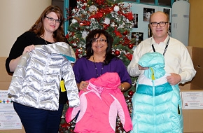 The clothing driveâs organizers â Margaret Gee (left), Yolanda Navarrete (center) and Dana Dorr â hold up some of the donated coats before providing them to Carlsbad area schools. Gee is with CBFO and Navarrete and Dorr are with Nuclear Waste Partnership (NWP). NWP's Yolanda Salmon, another drive organizer, is not pictured. The clothing driveâs organizers â Margaret Gee (left), Yolanda Navarrete (center) and Dana Dorr â hold up some of the donated coats before providing them to Carlsbad area schools. Gee is with CBFO and Navarrete and Dorr are with Nuclear Waste Partnership (NWP). NWP's Yolanda Salmon, another drive organizer, is not pictured.