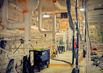 Piping in the east boiler basement of the sodium processing building was color coded for easy identification. Orange indicates sodium and green identifies cooling water. Piping in the east boiler basement of the sodium processing building was color coded for easy identification. Orange indicates sodium and green identifies cooling water.