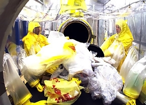 Workers sort through transuranic waste at the Savannah River Site. Workers sort through transuranic waste at the Savannah River Site.