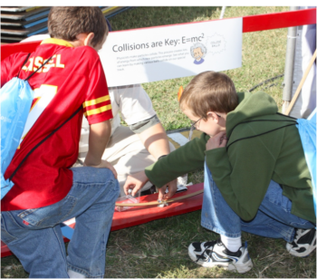 Students experiment with steel balls on a track as they learn about energy exchange during collisions during the USA Science and Engineering Festival held on the National Mall October 23-24. Students experiment with steel balls on a track as they learn about energy exchange during collisions during the USA Science and Engineering Festival held on the National Mall October 23-24.