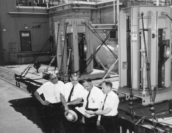 Checking a shipment of reactor fuel are, left to right, Samuel Edlow, U.S. Representative for Aktiebolaget Atomenergi of Sweden; S.D. Smiley, offsite fuels coordinator for the Du Pont Company at Savannah River; S.D. Tatalovich, Atomic Energy Commission international affairs representative; and Robert L. Chandler, chemical engineer with the Savannah River Operations Office. Checking a shipment of reactor fuel are, left to right, Samuel Edlow, U.S. Representative for Aktiebolaget Atomenergi of Sweden; S.D. Smiley, offsite fuels coordinator for the Du Pont Company at Savannah River; S.D. Tatalovich, Atomic Energy Commission international affairs representative; and Robert L. Chandler, chemical engineer with the Savannah River Operations Office.