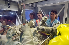 Workers treat sludge-bearing, transuranic waste from the Advanced Mixed Waste Treatment Project. Workers treat sludge-bearing, transuranic waste from the Advanced Mixed Waste Treatment Project.