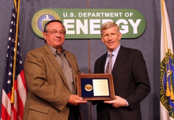 Deputy Secretary Daniel Poneman, right, presents the Secretary's Achievement Award to Richard Craun, representing the Idaho Operations Office. Deputy Secretary Daniel Poneman, right, presents the Secretary's Achievement Award to Richard Craun, representing the Idaho Operations Office.