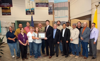 In 2013, a team of CBFO federal employees and WIPP contractors and subcontractors was recognized for initiatives to protect the environment through waste reduction and conservation efforts. In April, the New Mexico Environment Department selected WIPP as a Gold Level leader in the Green Zia Environmental Leadership Program, its highest recognition for environmental excellence (group photo). In August, WIPP was selected as an honoree in the category of sustainable workplace at the New Mexico Sustainable Business Summit held in Albuquerque, N.M. WIPP received the award by improving efficiencies and reducing the overall amount of hazardous waste generated in its groundwater-monitoring program. WIPP added to its achievements from latter 2012 when DOE recognized four environmental initiatives at WIPP and presented more than 20 employees with DOE Sustainability Awards for improvements in energy, water and fleet efficiency while reducing pollution and waste across the complex. In 2013, a team of CBFO federal employees and WIPP contractors and subcontractors was recognized for initiatives to protect the environment through waste reduction and conservation efforts. In April, the New Mexico Environment Department selected WIPP as a Gold Level leader in the Green Zia Environmental Leadership Program, its highest recognition for environmental excellence (group photo). In August, WIPP was selected as an honoree in the category of sustainable workplace at the New Mexico Sustainable Business Summit held in Albuquerque, N.M. WIPP received the award by improving efficiencies and reducing the overall amount of hazardous waste generated in its groundwater-monitoring program. WIPP added to its achievements from latter 2012 when DOE recognized four environmental initiatives at WIPP and presented more than 20 employees with DOE Sustainability Awards for improvements in energy, water and fleet efficiency while reducing pollution and waste across the complex.