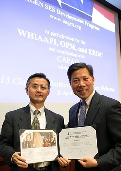 EMâs Dr. Ming Zhu, left, receives his certificate from Chris Lu, former Assistant to the President and Cabinet Secretary, at the AAGEN SES Development Program graduation ceremony in Washington, D.C. in April. EMâs Dr. Ming Zhu, left, receives his certificate from Chris Lu, former Assistant to the President and Cabinet Secretary, at the AAGEN SES Development Program graduation ceremony in Washington, D.C. in April.