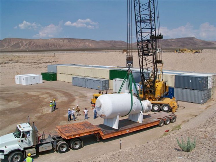 Waste management specialists disposed approximately 1.8 million cubic feet of low-level and mixed low-level radioactive waste at the Area 5 Radioactive Waste Management Site, which amounts to 2,558 shipments and 13,173 packages of waste. These volumes constitute approximately 5 percent of the low-level and mixed low-level waste generated throughout DOE complex. This photo shows Area 5 waste disposal operations Waste management specialists disposed approximately 1.8 million cubic feet of low-level and mixed low-level radioactive waste at the Area 5 Radioactive Waste Management Site, which amounts to 2,558 shipments and 13,173 packages of waste. These volumes constitute approximately 5 percent of the low-level and mixed low-level waste generated throughout DOE complex. This photo shows Area 5 waste disposal operations