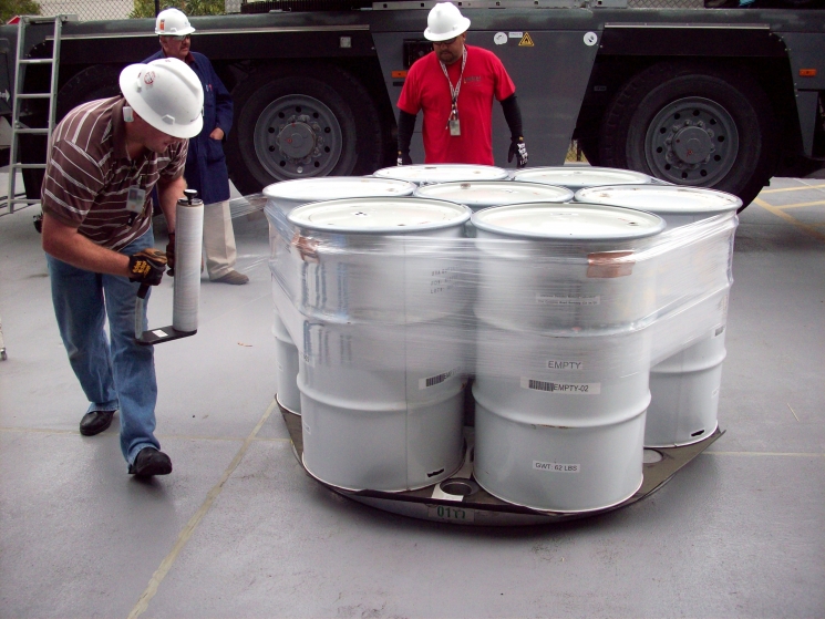 Operators prepare drums of contact-handled transuranic waste for loading into transportation containers Operators prepare drums of contact-handled transuranic waste for loading into transportation containers