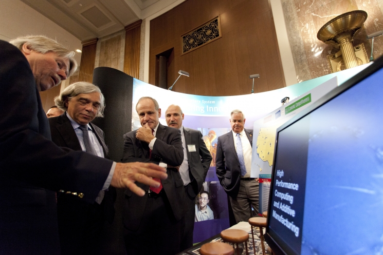 Secretary Ernest Moniz learns about the Labs' work in high performance computing and additive manufacturing. | Photo courtesy of Sarah Gerrity, Energy Department. Secretary Ernest Moniz learns about the Labs' work in high performance computing and additive manufacturing. | Photo courtesy of Sarah Gerrity, Energy Department.