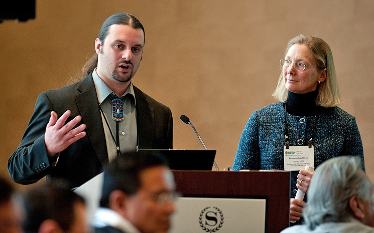 Travis Stone, Shoshone Bannock Tribe, and Rebecca Kauffman, Southern Ute Alternative Energy Investment Fund, speaking at the Office of Indian Energy Tribal Leader Energy Forum on transmission. Photo by Dennis Schroeder, NREL Travis Stone, Shoshone Bannock Tribe, and Rebecca Kauffman, Southern Ute Alternative Energy Investment Fund, speaking at the Office of Indian Energy Tribal Leader Energy Forum on transmission. Photo by Dennis Schroeder, NREL