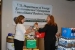Kimberly Dellinger and Michelle Litmer with EMCBC prepare donations for the campaign.