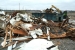 Workers cut up old trailers and placed them in containers so that the debris could be placed in the site’s industrial landfill.
