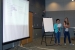 NSSAB student liaisons Gumabon, left, and Leavitt discuss their project involving a student survey and educational tool to members of the NSSAB.