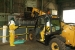 Forklift operator
A spotter, left, helps a forklift driver safely drop debris into a roll-off bin in the Feed Plant.