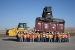 The day crew at the Crescent Junction Disposal site stands in front of the container carrying the 4 millionth ton of mill tailings from the Moab site.