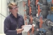 Dean Neshem, a pump-and-treat operations and maintenance engineer, observes operations at one of the Hanford site's five groundwater treatment facilities. Based on 
technical recommendations from DOE, CH2M HILL engineers tested and compared multiple resins to determine the products capable of removing contaminants from the groundwater.