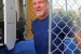 Senior Advisor for Environmental Management David Huizenga stands after falling into a dunk tank during an event to collect nonperishable food items for the DOE Feeds Families campaign.