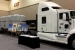 Three HalfPACT transportation packages on a Waste Isolation Pilot Plant (WIPP) truck are parked inside the exhibit hall at the 2013 Waste Management Conference. WIPP featured the exhibit as part of outreach to visitors at the annual gathering in Phoenix.