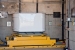 A standard waste box enters the HE-RTR at Los Alamos National Laboratory. The facility x-rays waste drums that contain high-density items such as motors and pumps and larger containers known as standard waste boxes.