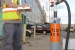 Neil Smith puts a trained eye on the pressure and flow of a food-grade com¬pound being injected into an under¬ground plume of hazardous waste near the X-720 Maintenance Facility at the DOE Piketon Site. The sodium lactate compound promotes bacterial growth in the groundwater that turns hazardous waste into harmless end-products.