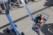 Workers use a lift to access part of the 200 West Groundwater Treatment Facility.