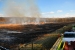 Firefighters keep watch as the controlled prairie burn is completed at the Portsmouth Site.