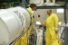 Workers relocate a pipe overpack container used to transport small amounts of excess plutonium oxide destined for long-term storage at the Waste Isolation Pilot Plant in Carlsbad, New Mexico.