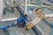 A robotic device named Tizzy was retrofitted by Savannah River Remediation (SRR) employees to collect and remove tank waste. Using $100,000 from the Recovery Act, SRR designed and built Tizzy. Here the robot is being tested on a mock-up of a waste tank